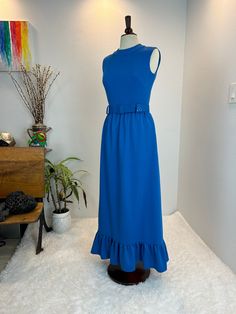 1970s Maxi Dress / 60s Maxi Dress / 1970s Dress 1960s dress and belt This beauty is a late 1960s / early 1970s maxi dress. She is a Maxi dress in a lovely shade of blue with rhinestone belt loops. Her belt is a wide slide belt that is fully adjustable. This dress has a zipper in the back.  Measurements provided are flat and have been doubled. Bust 36" Waist 28"  Hips 42" Length 55" ❤️ Condition: Excellent vintage condition. Flaw: slight stain on belt. The dress has some evidence of wear, where the belt goes around the middle. Please see picture. This item has been cleaned and is ready to wear. $148 includes domestic shipping and insurance. International shipping is $30. Please let me know if you have questions, would like more measurements, or photos. I am here to help. 💜Megan Fitted Maxi Dress With Belt For Spring, Spring Fitted Maxi Dress With Belt, Retro Floor-length Dresses For Vintage Fashion, Retro Floor-length Vintage Fashion Dress, Vintage Dresses With Belt For Spring, Retro Belted Dresses, Vintage Belted Evening Dress, Vintage Midi Belted Dress, 1970s Style Maxi Vintage Dress