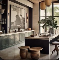 a kitchen with lots of counter space and stools