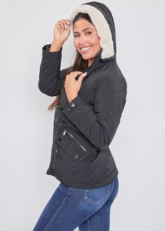 Keep warm in style in our Puffer Lined Shell Jacket with Fur Hood. This is a versatile jacket made with a wind, water, and snow-resistant fabric. Featuring a removable Sherpa-lined hood. This jacket is reversible and can be worn both ways, as well as with or without a hood, making it a 3-in-1 jacket! Featuring front zippers, drawstrings, and metal snap buttons for a utility-inspired look. Pair this jacket with a cozy turtleneck, denim, and combat boots for some edge. Finish the look with a knit Casual Nylon Parka For Winter, Casual Nylon Winter Parka, Nylon Outerwear With Fleece Lining For Cold Weather, Winter Outerwear With Detachable Hood, Nylon Hooded Jacket With Detachable Hood For Cold Weather, Winter Nylon Hooded Jacket For Cold Weather, Winter Weatherproof Nylon Hooded Jacket, Winter Utility Jacket With Fleece Lining For Outdoor Activities, Weatherproof Hooded Outerwear For Cold Weather