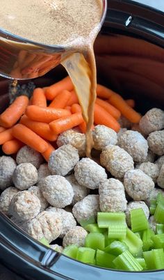 carrots, celery and meatballs are being poured into the slow cooker