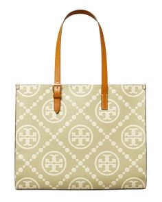 Tory Burch tote bag in T monogram embossed leather  Adjustable buckle shoulder straps, 10.2" drop Open top with side snap closures  Interior, one zip pocket and one slip pocket  Lining: Nylon/polyurethane Approx. 12.4"H x 15.8"W x 6"D Imported Tory Burch Tote Bag, T Monogram, Tory Burch Tote, Tory Burch Bag Totes, Monogrammed Leather, Press Studs, Open Top, Green Leather, Leather Tote Bag