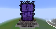 a tall purple tower sitting on top of a green field