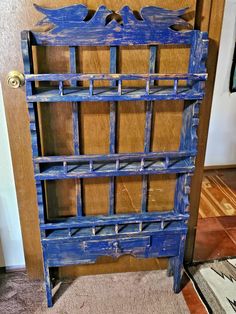 an old blue book shelf with birds on it