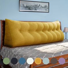 a bed with a yellow pillow on top of it and several different color swatches