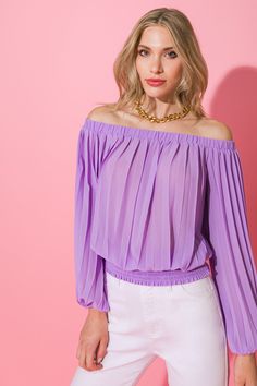 A solid woven top featuring accordion pleats, and elasticized off-the-shoulder neckline, long bishop sleeves, and a wide smocked waistband. Details Self: 100% polyester Size & Fit - Model is 5`8" and wearing size Small - Measurements taken from size Small - Length: 15" Trendy Spring Party Blouse, Trendy Party Blouse For Spring, Trendy Blouse For Spring Party, Trendy Evening Blouse In Solid Color, Chic Non-stretch Party Top, Spring Party Non-stretch Blouse, Spring Party Blouse Non-stretch, Purple Tops For Night Out In Spring, Chic Fitted Purple Blouse