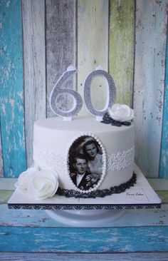 a 50th birthday cake with the number sixty on it