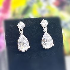 "Length : 0.8\" (2 cm) Main Stone Size: 1.2 cm X 0.8 cm (3 Carat / each) Main Stone Color: Clear White Main Stone Shape: Pear Cut Metal: Real Solid 925 Sterling Silver Hallmark: 925 Plating: Rhodium Plated Stones Setting: Prong Stones: High Quality Lab Moissanite Diamond Finish: High Polished Pear Dangle Drop Earrings 3 Carat Pear Cut Lab Moissanite Diamond 925 Sterling Silver Dangle Drop Wedding Earrings Gift Boxed For Her" Silver Pear-shaped Diamond Earrings For Formal Events, Formal White Gold Pear-shaped Teardrop Earrings, Formal Pear-shaped Teardrop Earrings In White Gold, Formal White Gold Teardrop Earrings, Formal Bridal Earrings With Brilliant Pear Cut, Dazzling Pear-shaped Jewelry For Gift, Pear Shaped Brilliant Cut Bridal Earrings For Formal Occasions, Pear-shaped Bridal Earrings With Brilliant Cut For Formal Occasions, Formal Pear-shaped Bridal Earrings With Brilliant Cut