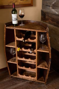 a wine bottle and some glasses on a wooden shelf