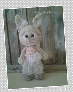 a crocheted stuffed animal wearing a dress