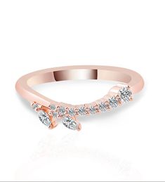 a rose gold ring with three diamonds on the side and an arrow design in the middle