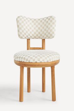 an upholstered wooden chair with checkered fabric on the back and seat cushion