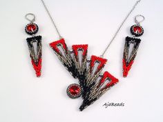 three pieces of beaded necklace and earring set in red, black and silver