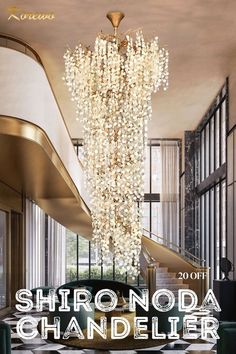 a chandelier hanging from the ceiling in front of a checkerboard floor