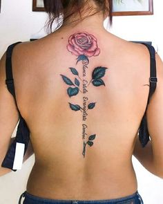 a woman with a rose tattoo on her back