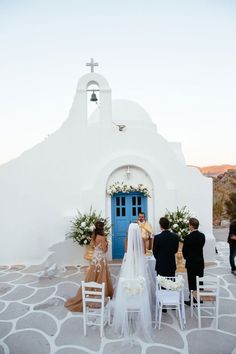 the bride and groom are getting ready to walk down the aisle at their wedding ceremony