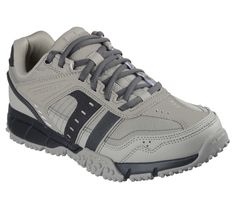 Tear into the terrain in sporty style and trail-walking comfort with Skechers Urban Trax. This casual hiker features a lace-up leather and synthetic upper with a cushioned Skechers Air-Cooled Memory Foam insole. | Skechers Men's Urban Trax Sneaker | Medium Width | Skechers Air-Cooled Memory Foam cushioned comfort footbed | Lace-up leather and synthetic upper | Flexible traction outsole | 1/4-inch heel | Skechers Cushioned Lace-up Walking Shoes For Outdoor Activities, Slip-resistant Lace-up Sneakers For Outdoor Work, Cushioned Sneakers For Outdoor Work, Sporty Slip-resistant Lace-up Hiking Boots, Cushioned Tpr Walking Shoes For Outdoor Activities, Sporty Walking Shoes, Sporty Round Toe Walking Shoes For Outdoor Work, Rugged Sports Sneakers With Cushioned Footbed, Rugged Synthetic Sneakers For Outdoor Activities