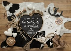 a heart shaped plaque surrounded by other items on a wooden surface with the words, every good and perfect gift is from above