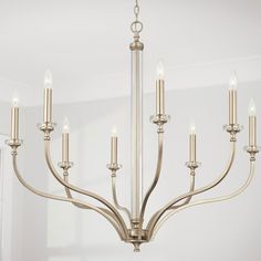 a chandelier with six candles hanging from it