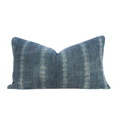 a blue pillow on a white background