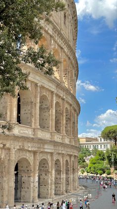 tourists walk around the ruins of an ancient building