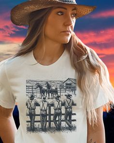 Add a touch of rugged charm to your wardrobe with this vintage western cowboy shirt! Perfect for the country western loving girl.  MOST IMPORTANTLY, THANK YOU FOR BEING HERE AND CHECKING OUT OUR FASHIONABLE DESIGNS. OUR CUSTOMERS ARE THE HEART OF OUR BUSINESS! ALL SHIRTS ARE DTG PRINTED IN THE USA.  ALL BELLA-CANVAS TEES & SWEATSHIRTS ARE UNISEX SHIRTS. ALL ORDERS SHIPPED IN 2-5 DAYS, DEPENDING ON AVAILABILITY & HOLIDAYS. PLEASE CONSULT THE CHARTS TO DETERMINE THE BEST SIZE & COLOR. IF YOU WOULD Country Style Cotton Shirt For Rodeo, Western Style Short Sleeve Shirt For Rodeo, Western White Tops For Rodeo, Vintage Cotton Tops For Country Events, Western Cotton Shirt For Country Events, Fitted Country Style Tops For Rodeo, Western Style Tops For Country Concerts, Country Style Short Sleeve Tops For Western-themed Events, White Western Tops For Country Events