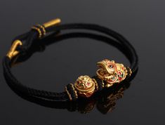 A 24k Real Gold Bracelet with a traditional Chinese lion-dance and treasure bowl is carefully handmade to commemorate wealth, fortune, strength, and good luck.  The Lion-Dance charm is made of 24K 999 Pure Gold and is 14mm wide, 16mm long, and 10.5mm high. Meanwhile, the Treasure Bowl charm has a diameter of 11.3 mm and a height of 11.1 mm, making a total gold weight of approximately 2.7 g.  This minimalist style bracelet features a handmade hand braided bracelet cord that is adjustable to fit c Traditional Bangle Wristband As Gift, Traditional Wristband Bracelet For Gifts, Traditional Yellow Gold Bracelets For Rituals, Traditional Adjustable Wristband Bracelet, Traditional Adjustable Gold Beaded Bracelets, Adjustable Gold Beaded Bracelets For Rituals, Traditional Yellow Gold Ceremonial Bracelets, Adjustable Spiritual Bracelets For Ceremonial Use, Traditional Gold Beaded Bracelets For Rituals