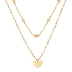 Love to layer? Meet your match with the Kendra Scott Ari Heart Multi Strand Necklace that features two delicate chains that come together for the perfect layered look. For a touch of romance, the longer strand features an asymmetrical heart pendant, while the shorter stand adds a little edge with geometric stations. Crafted in 14k gold-plated brass, the chains measure 14 inches and 16 inches in length and come with a 2 inch extender. Christmas Must Haves, Park Avenue Princess, Dr Accessories, Girl Barbie, Bday Gifts, Kendra Scott Necklace, Chocker Necklace, Valentine's Gifts, Gold Necklace Layered