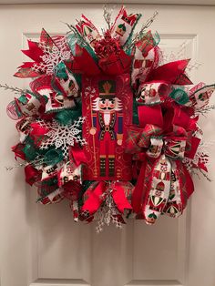 a christmas wreath hanging on the front door