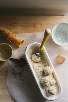 an ice cream dish with scoops and spoon