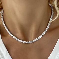 The most Incredible one! 30 Carat of top quality lab created diamond tennis necklace! 87 top quality, lab grown white diamonds, 4 prongs setting for each diamond, set as a tennis chain In 14k white gold. Sits so perfect on a women neck, for a luxurious amazing look, that no one can't miss! Double locking for extra safety. This tennis necklace will fit perfectly for the classic bride, special anniversary gift or round bday! Please contact us for size customization and gold color. Details: ⟡ 87 la Luxury Diamond Station Necklace Fine Jewelry, Luxury Baguette Diamond Anniversary Necklace, Tiffany Tennis Necklace, Diamond Tennis Necklace White Gold, Luxury Dazzling Diamond Necklace With Prong Setting, Gold Diamond Jewelry Necklace, Luxury Brilliant Cut Lab Grown Diamond Necklaces, Luxury Baguette Diamond Necklaces For Women, Luxury Baguette Diamond Necklaces