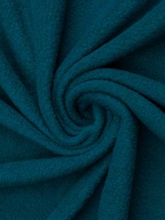 a close up shot of the fabric in teal blue, which is very soft