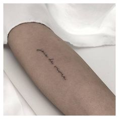 a woman's arm with the word love written in cursive writing on it