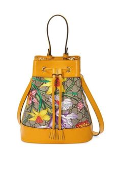 Gucci add their Flora pattern to this contemporary bag for a high-impact look.Floral printMonogram printDrawstring fasteningRound top handle and an adjustable shoulder strap.Composition: Leather 100%, Canvas 100%Lining: Suede 100%, Microfibre 100%Measurements: Depth 2", Heigh 3.9", Width 3.1", Handle1.8",Strap 8.3"Made in Italy Flora Pattern, Small Bucket Bag, Flora Print, Small Buckets, Gucci Ophidia, Gucci Monogram, Bucket Bags, Patterned Backpack, Contemporary Fabric