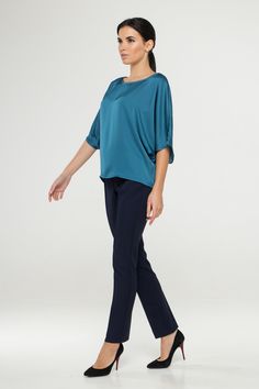 "A soft satin blouse featuring a boat neckline, half dolman sleeves, loose silhouette, and a relaxed fit. - kimono style blouse - loose silhouette - boat neck - half sleeves - Color: blue Fiber: 30% viscose, 70 % polyester. You may feel free choosing the size. Just send us your measurements (bust, waist, hips, height). We will define your correct size. SIZE CHART XS __ EU 34 __ US 4 bust: 31,5\" | 80 cm waist: 24,5\" | 62 cm hips: 34,5\" | 88 cm S __ EU 36 __ US 6 bust: 33,0\" | 84 cm waist: 26, Silk Tops With Draped Sleeves For Work, Silk Top With Draped Sleeves For Work, Elegant Solid Color Top With 3/4 Sleeves, Chic Stretch Viscose Blouse, Elegant Blue Half Sleeve Top, Elegant Blue Viscose Blouse, Elegant Half Sleeve Relaxed Fit Blouse, Elegant Tops With Draped Sleeves For Summer, Elegant Half Sleeve Tops For Workwear