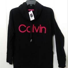 Nwt Calvin Klein Small Black Funnel Neck Drawstrings Pink Logo Pullover Calvin Klein Women's Sweatshirt Black Mock Neck Pink Logo Ck Small Fleece Lined Calvin Klein Cowl Neck Pullover Sweater Is Comfortable, Warm And Fashionable. Mock Neck With Drawstring 60% Cotton, 40% Polyester Machine Wash Cold Water Do Not Use Fabric Softener Do Not Bleach L 27.5" Armpit To Armpit 24" Thanks For Your Business Calvin Klein Crew Neck Tops For Loungewear, Calvin Klein Long Sleeve Tops For Fall, Calvin Klein Long Sleeve Tops For Loungewear, Trendy Calvin Klein Tops For Fall, Trendy Calvin Klein Fall Tops, Trendy Calvin Klein Top For Fall, Calvin Klein Crew Neck Winter Tops, Calvin Klein Winter Crew Neck Tops, Calvin Klein Black Long Sleeve Tops