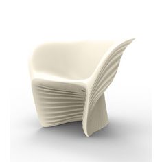 a white chair sitting on top of a white floor