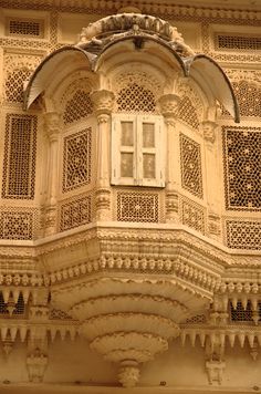 an old building with ornate carvings on the side