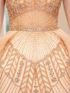 the back of a dress with beading and sequins