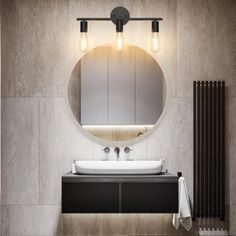 a bathroom with a sink, mirror and radiator in front of the wall