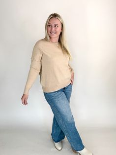 This cozy sweater, in a soft oatmeal, offers a timeless look that’s easy to dress up or down. Wear it alone for a simple, chic outfit, or layer it under a vest or flannel for added warmth and style. Available in small, medium, large, & extra large Color: Oatmeal Emily is 5'6" and has a 34c bust. She is wearing a medium. Runs true to size Ribbed round neckline Ribbed cuff and hem Paired here with our Megan Mid Rise Raw Hem Wide Leg Denim