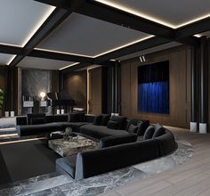 a large living room with black furniture and blue curtains