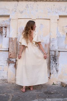 Raw Eri Ahimsa silk dress with drawstring and deep neck in beige colour. Soft and light fabric with rustic texture. Perfectly fitting sizes from S to M. Open back makes it a best dress for warm summer days and nights. Also can be worn for a special occasion, as a wedding dress. It has a loose, maxi silhouette below the drawstring and can be used as maternity dress or feeding dress. Dress has a double layer of lining in top and skirt to avoid transparency. This beautiful dress made from raw Eri s V-neck Dress With Back Tassel Tie-up For Summer, V-neck Maxi Dress With Natural Dye For Summer, Long Bohemian Dress With Back Tassel Tie-up, Beige Long Midi Dress For Beach, Spring Flowy Dresses With Natural Dye, Bohemian V-neck Dress With Natural Dye, Flowy Spring Dresses With Natural Dye, Spring Maxi Dress With Natural Dye, Spring Maxi Length Dress With Natural Dye