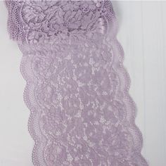 an image of purple lace hanging on the wall