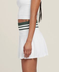 Midtown Tennis Skirt | Wilson Sporting Goods Summer Sports Pleated Skirt, Cheerleading Tennis Skirt In Athleisure Style, Sporty Mini Tennis Dress, Athleisure Mini Tennis Skirt For Cheerleading, Sporty Tennis Dress With Mini Skirt, Sporty Mini Skirt Tennis Dress, Sporty Pleated Skirt With Built-in Shorts, Athleisure Mini Tennis Skirt With Lining, Sporty Pleated Mini Skirt