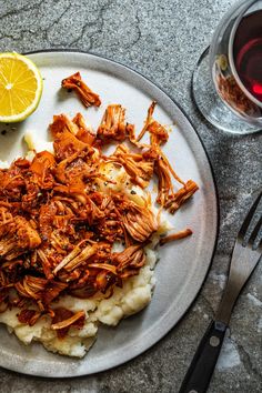 a plate with meat and mashed potatoes on it