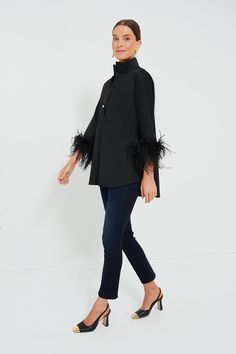 Our favorite blouse gets the ultimate glam girl update: feathers! The Willow has the perfect stand collar and gorgeously feathered sleeves to create a party piece that can be worn with effortless ease. Complete with a boxy but not oversized fit, this pullover can be styled with everything from denim to leather for glamorous get-togethers and cocktail parties this season! Stand collar Three-quarter length sleeves Feather cuffs Half-placket neckline Gold ball button Boxy fit Material: 100% Polyest Feathered Sleeves, Feather Cuffs, Glam Girl, Cocktail Parties, Black Feathers, Black Blouse, Cocktail Party, Three Quarter, Stand Collar