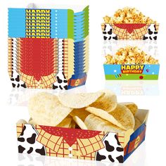 two boxes filled with chips and some kind of food in them on top of a table