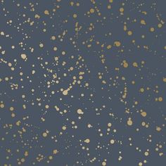 a blue and gold wallpaper with lots of small dots on the top of it