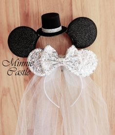 a mickey mouse head with a tulle skirt and top hat on it's head