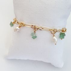 Fancy wristband Chain 18k gold plated large links 4mm 5mm white pearl charms Green chip stones. Length 16cm Adjustable Green Pearl Chain Jewelry As A Gift, Dainty Green Gold Plated Bracelets, Elegant Green Metal Charm Bracelet, Green Gold-plated Bracelet For May Birthstone, Elegant Gold Pearl Bracelet With Charms, Gold Plated Green Jewelry With Charms, Green Gold-plated Bracelet As Gift, Green Gold Plated Bracelet As A Gift, Green Gold Plated Jewelry With Charms